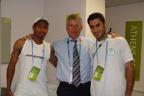 Dr. Mandelbaum with two Iraqi soccer players at the 2000 Olympics
